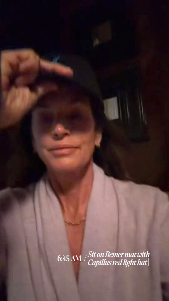 Cindy Crawford using the Capillus red light hat in the morning